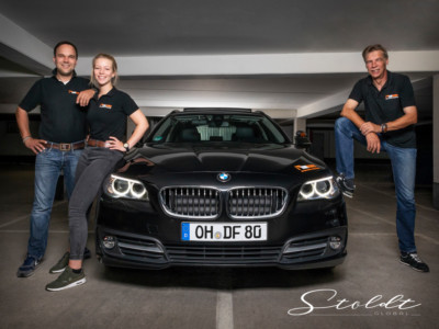 Business photography driving school teachers posing with a car