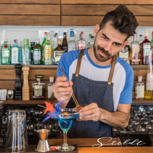 Business photography barman preparing a cocktail in Mallorca