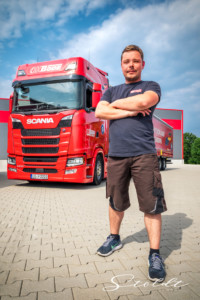 Business photography for transport company Spedition Bode showing trucker posing in front of truck