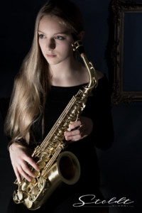 Beauty portrait photography of a girl with saxophone