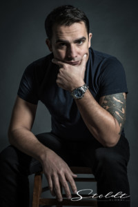 Portrait of a thinkful man with a wrist watch