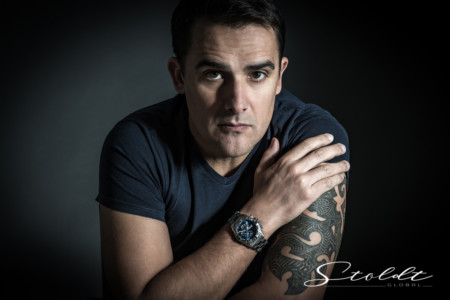 Portrait of a man with a wrist watch close-up