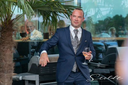 Wedding photography in Valencia Sagunto Castellón and Mallorca showing groom with glass of wine