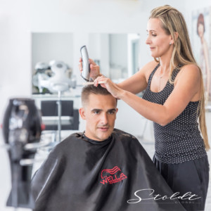 Business photography hairdresser cutting hair of a client