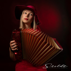 Photography portrait of a musician with accordion instrument