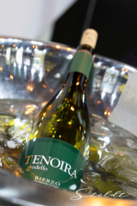 Business photography at the Madrid fair showing wine bottle in a coole