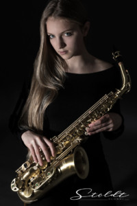 Beauty portrait photography of a musician with saxophone