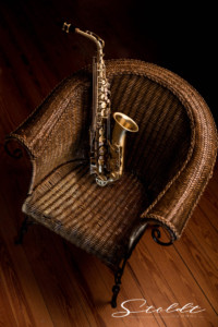 Music photography saxophone lying on a chair