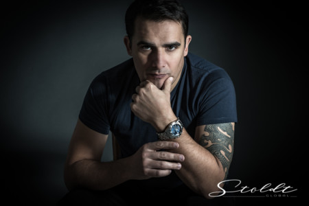 Portrait of a man with a wrist watch