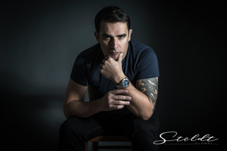 Portrait of a man with a wrist watch